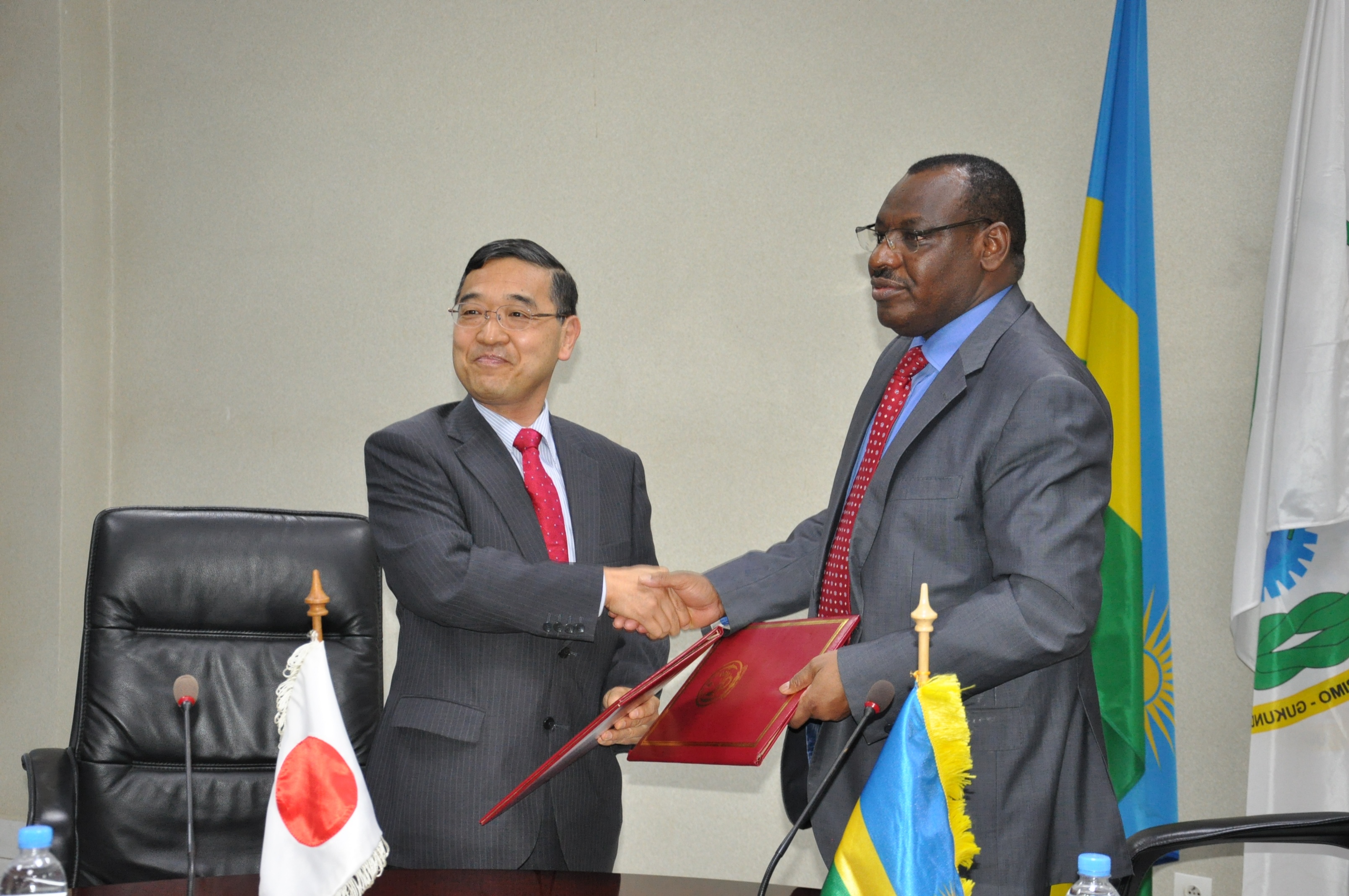 Ambassador Miyashita and Minister Gatete after signing