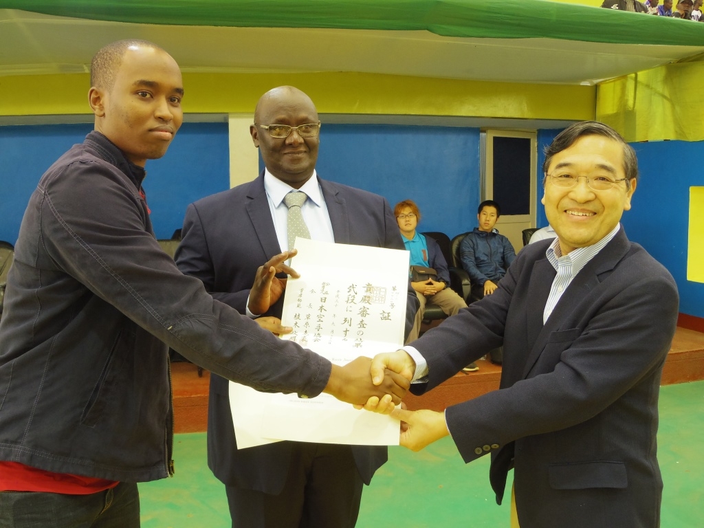 Ambassador Miyashita awarding a certificate of a new “dan” grade